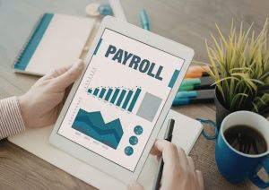 tablet with payroll text
